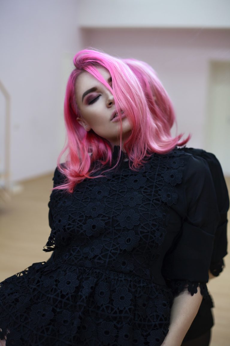 a woman with pink hair