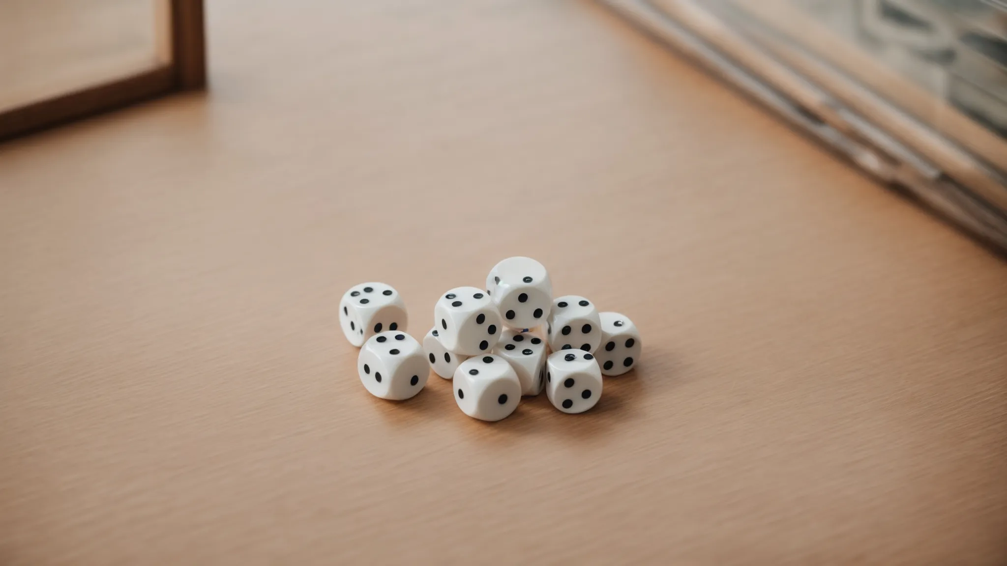 a blank set of dice on a table, with space for indicating different outcomes.