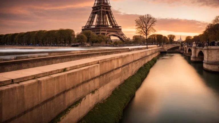 a picturesque view of the eiffel tower with the seine river flowing gently in the foreground under a sunset sky.