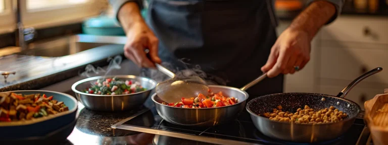 a person preparing different bowls of food for pets.