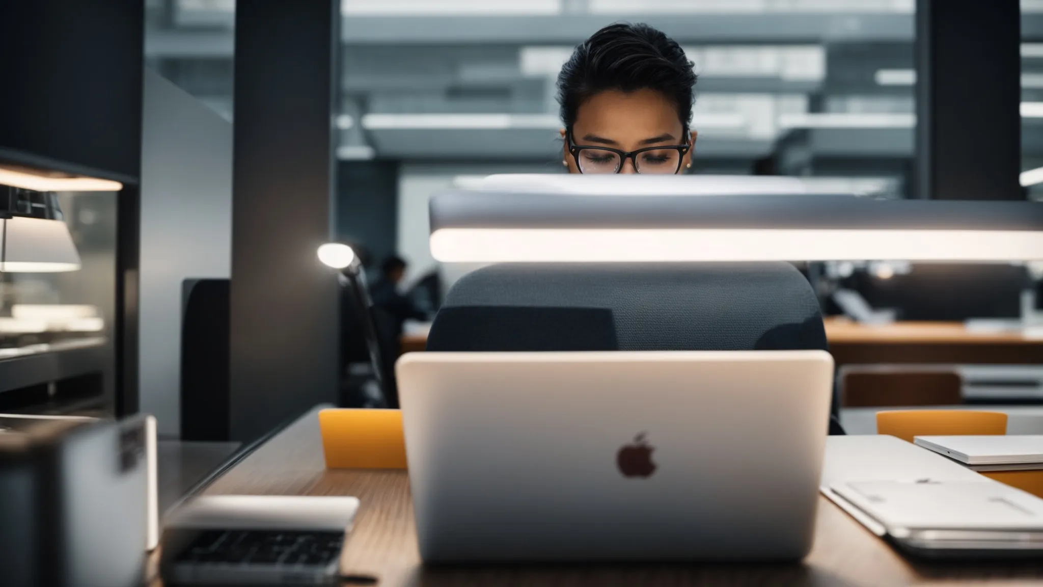 a person swiftly scrolls through a fast-loading website on their laptop in a bright, modern office.